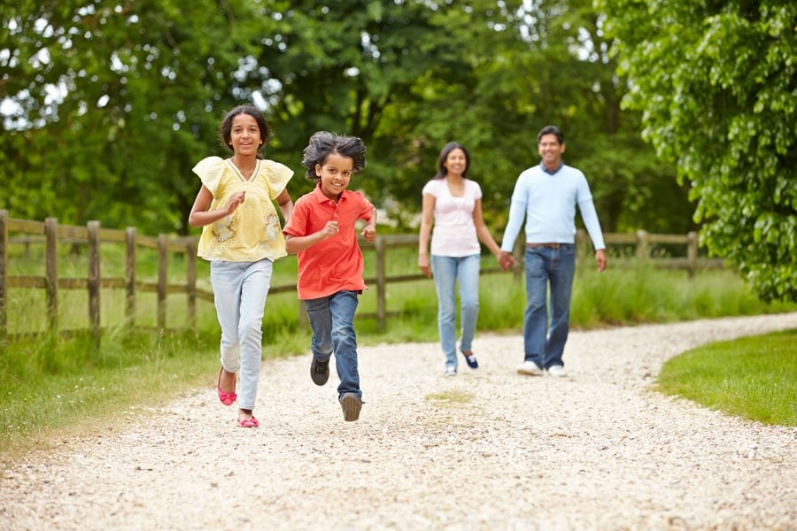 Family holding taking a stroll