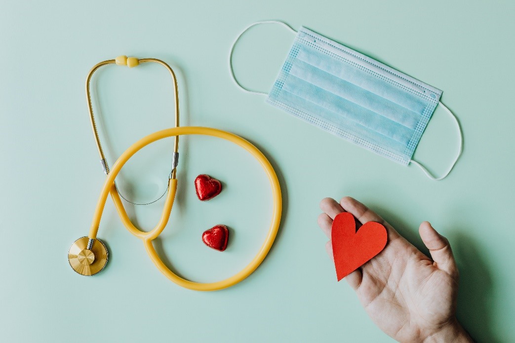 Stethascope, hearts, face mask and hand image