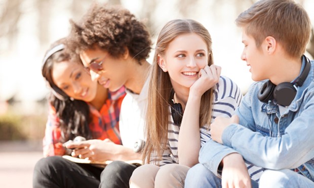 Youth sitting down and chatting