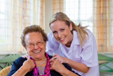 Caregiver taking a photo with her client.