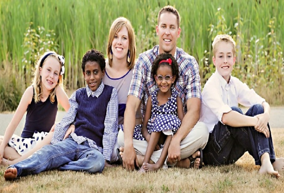 Foster family posing for a picture