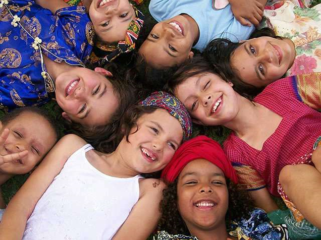 Group of children laying in the grass